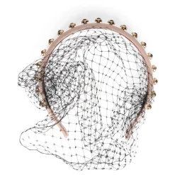 Accessorio per capelli di colore rosa dal design elegante e ricercato.