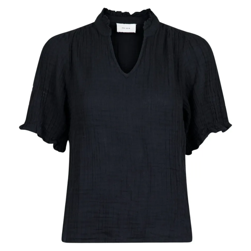 Blusa in lino nero con dettagli a balze