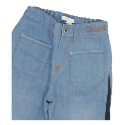 Jeans a gamba larga a vita media