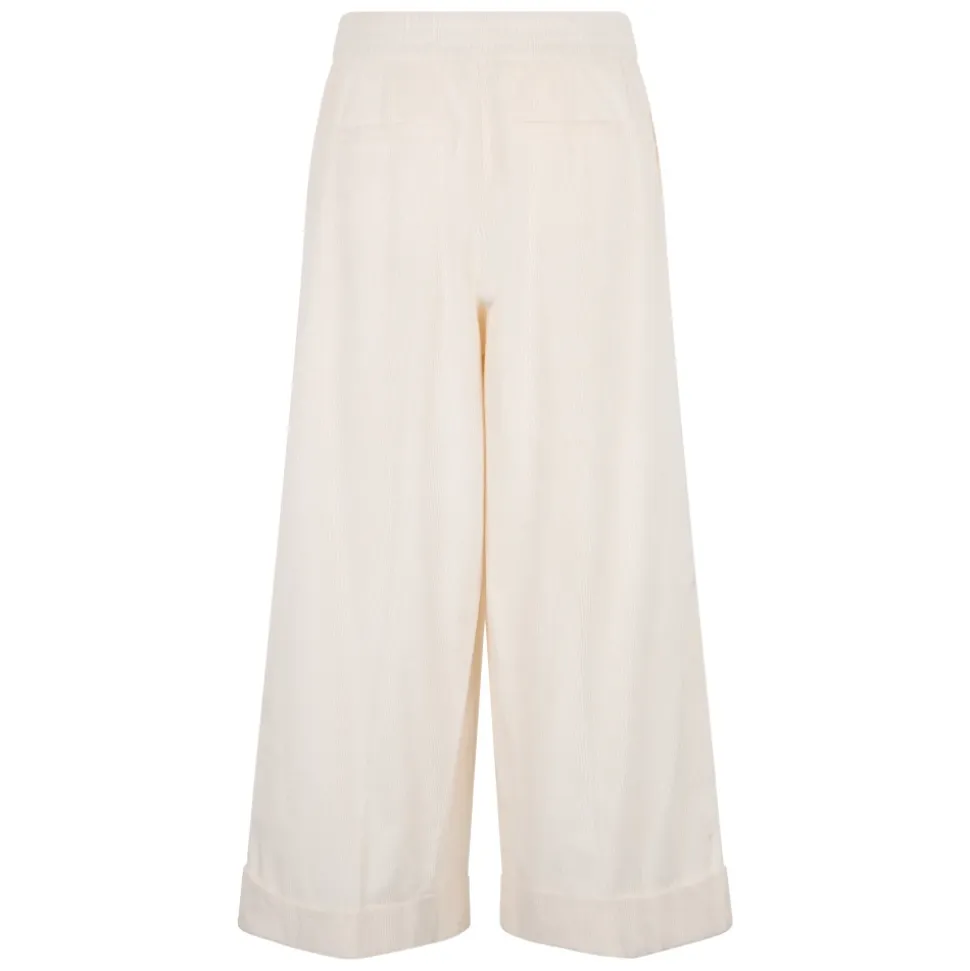 Pantaloni ampi color bianco panna dal design versatile e minimalita.