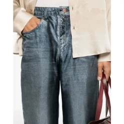 Pantaloni blu con zip e stampa trompe l`oeil