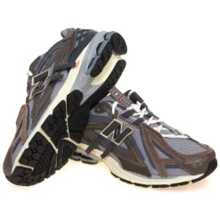 Sneaker New Balance 1906A in ecopelle, mesh e camoscio a pannelli sovrapposti